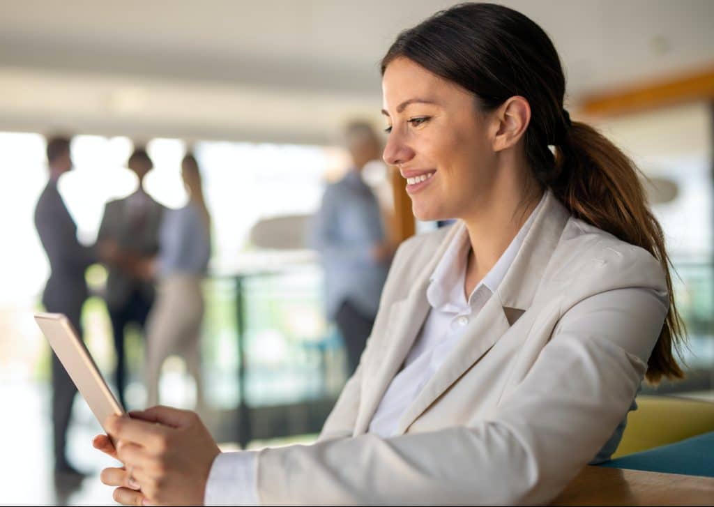 Portrait of a successful business woman using digital tablet in office